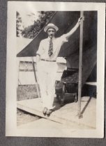 A man standing on a wood tent floor at Arden Shore